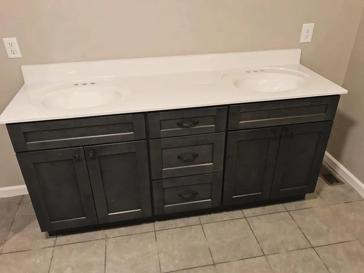 Dark double vanity with granite top