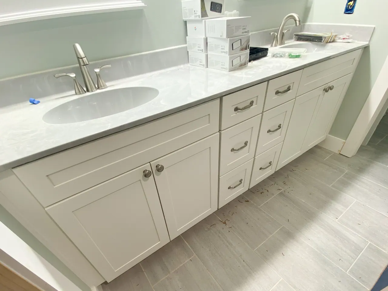 White vanity with integrated sink and drawers