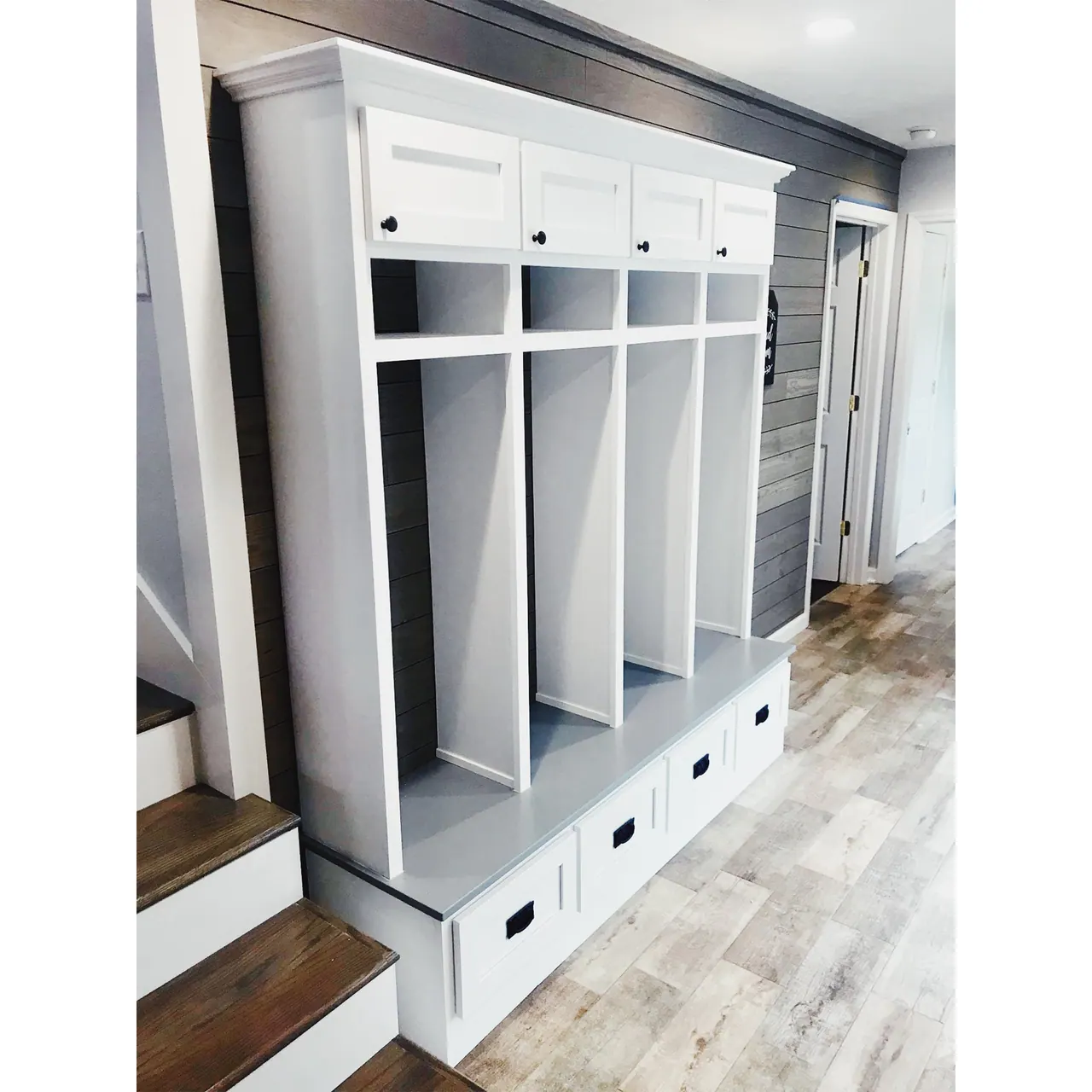 White mudroom lockers with bench and cubbies
