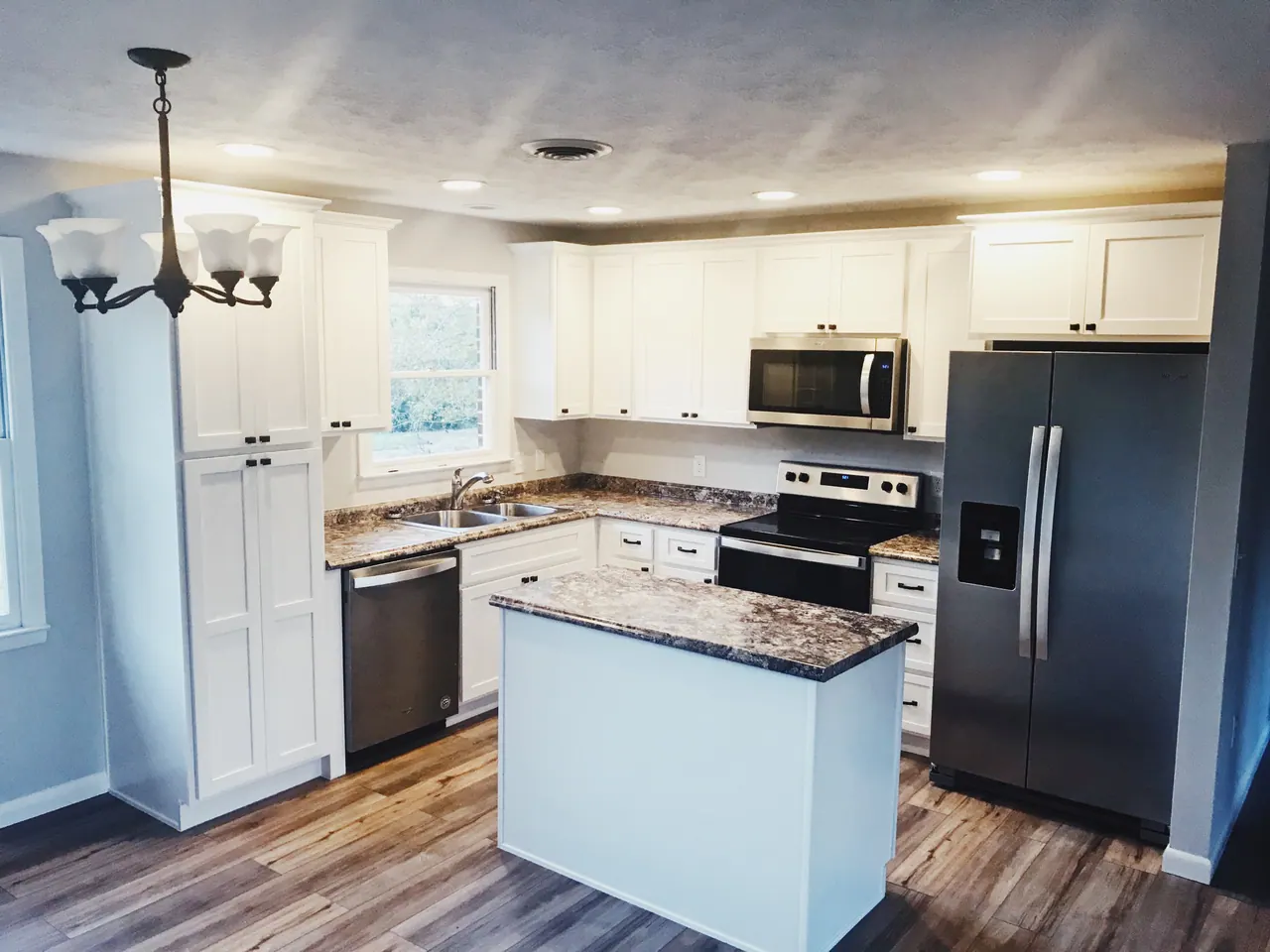 White kitchen with gray island