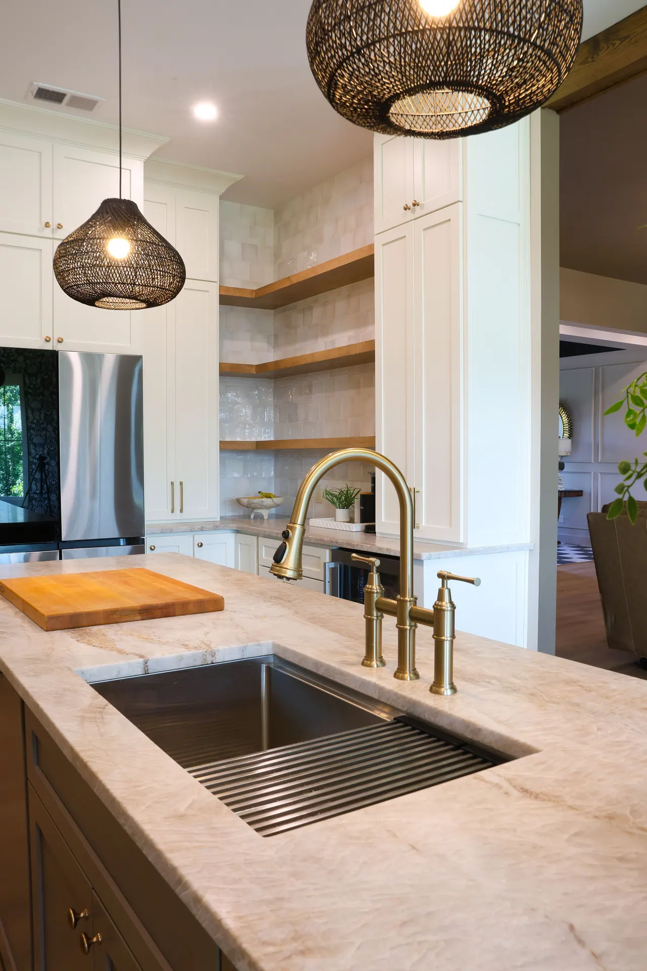 Sink view with open shelving and pendant light
