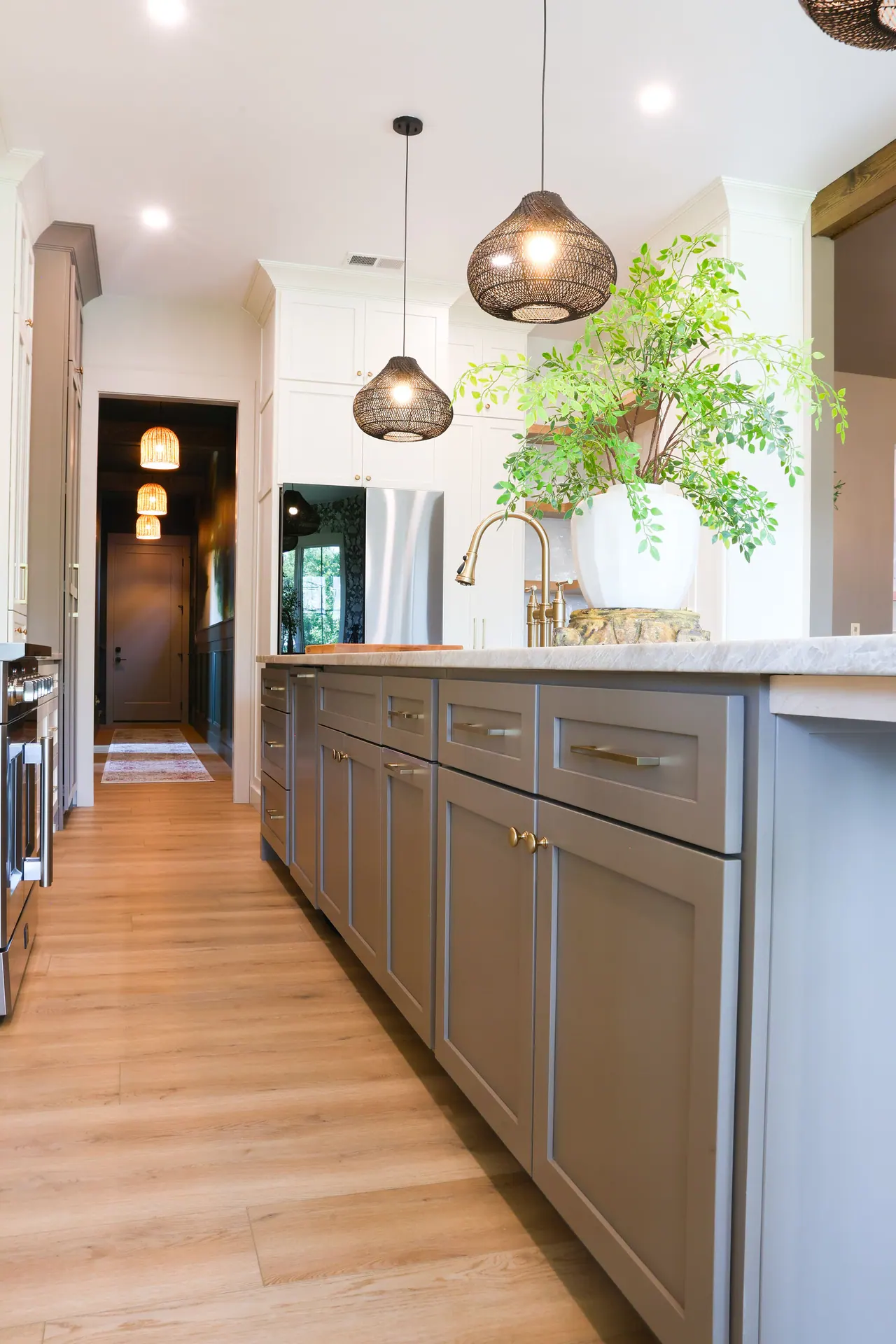 Stained island with drawer bank and pendants